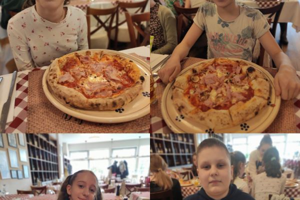 Chłopcy i dziewczynki z własnoręcznie przygotowaną pizzą